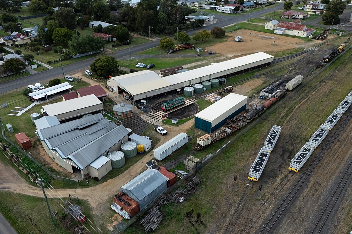 Aerial view of the working Warwick rail precinct with sheds and rolling stock